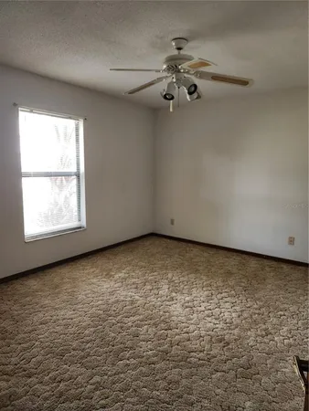 en empty room with windows