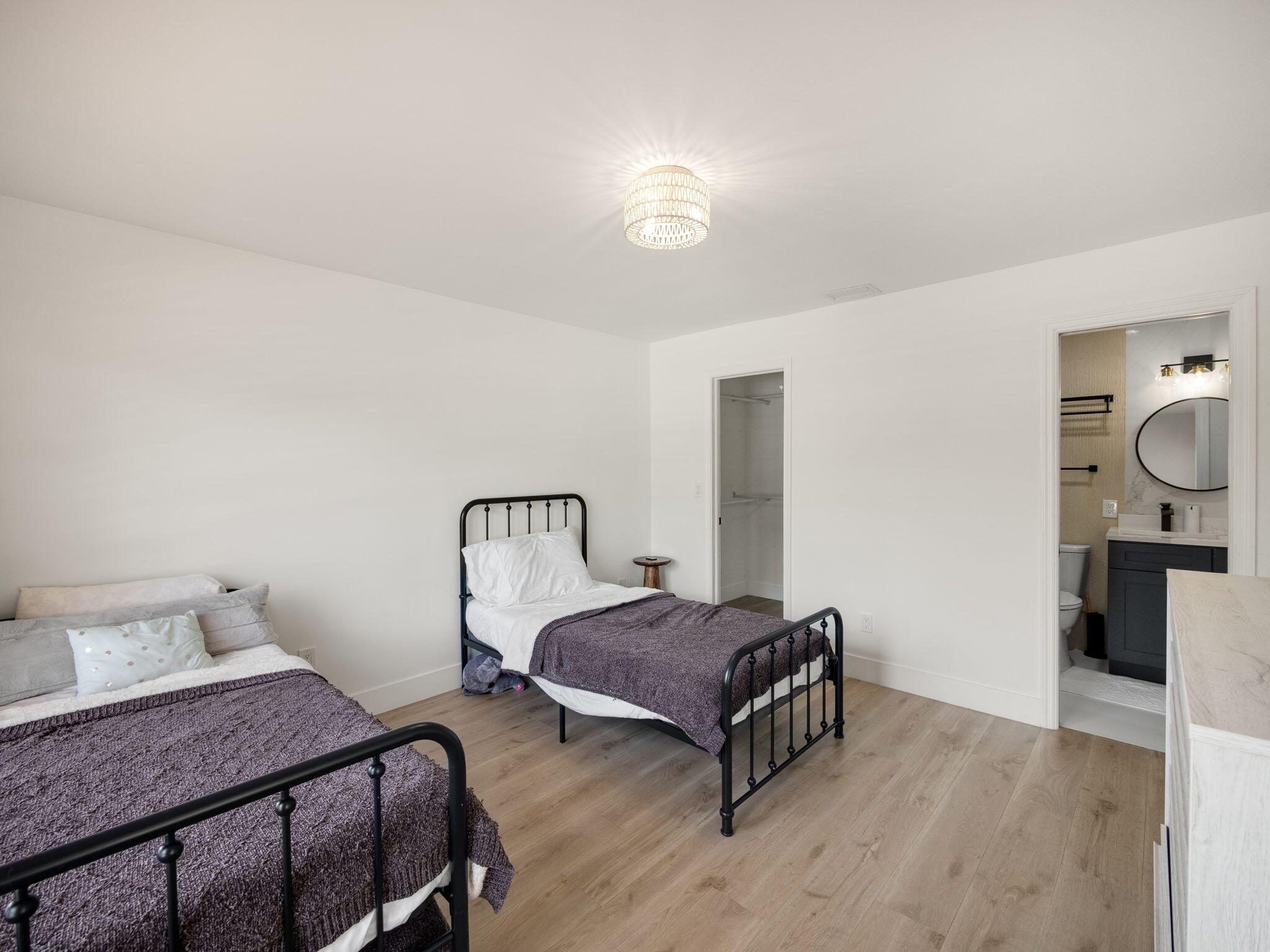 1423 Riverside Circle Wellington, FL 33414 - Photo 12 of 29 a bedroom with a bed and wooden floor