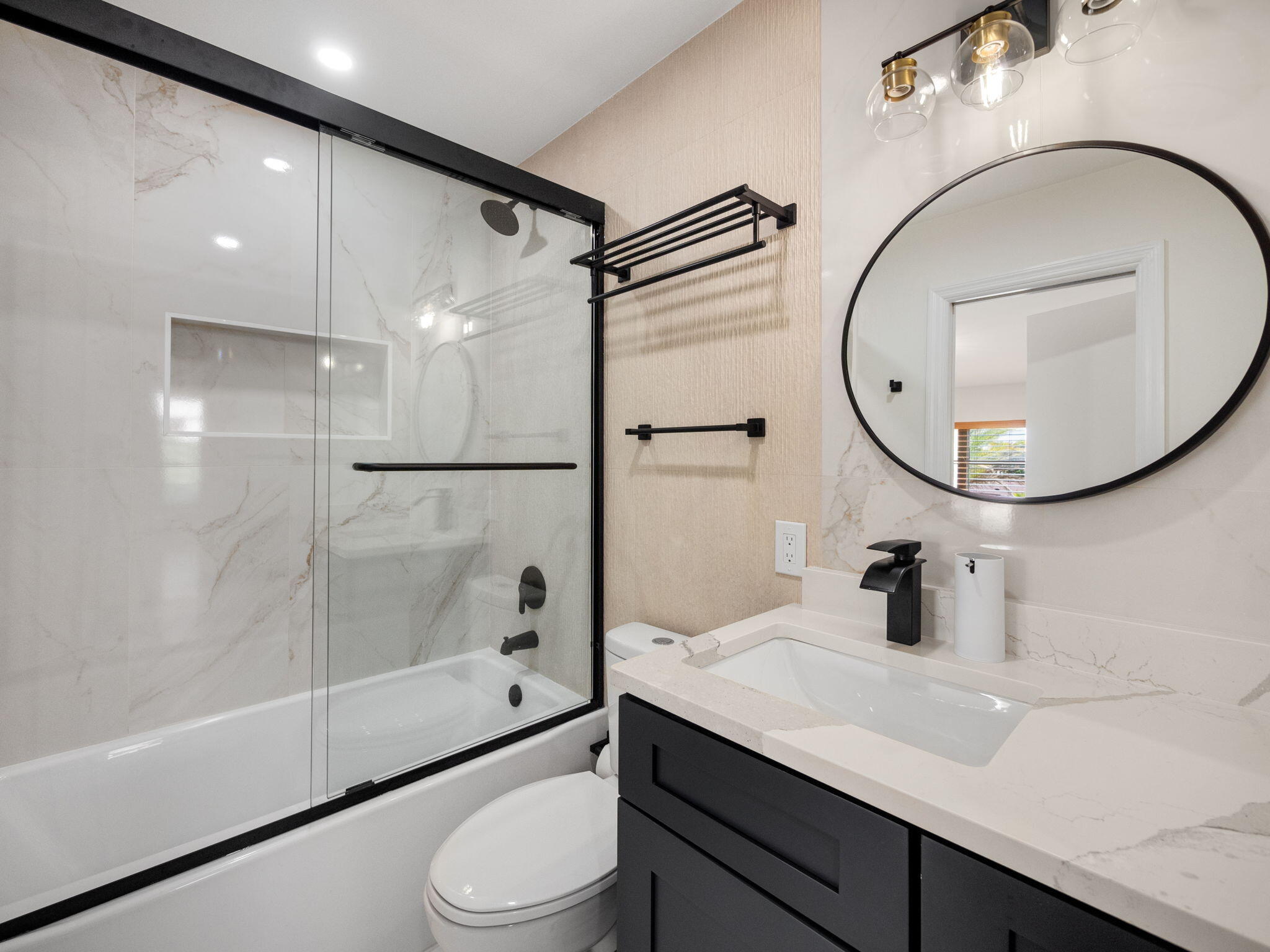 1423 Riverside Circle Wellington, FL 33414 - Photo 13 of 29 a bathroom with a sink a toilet and a mirror