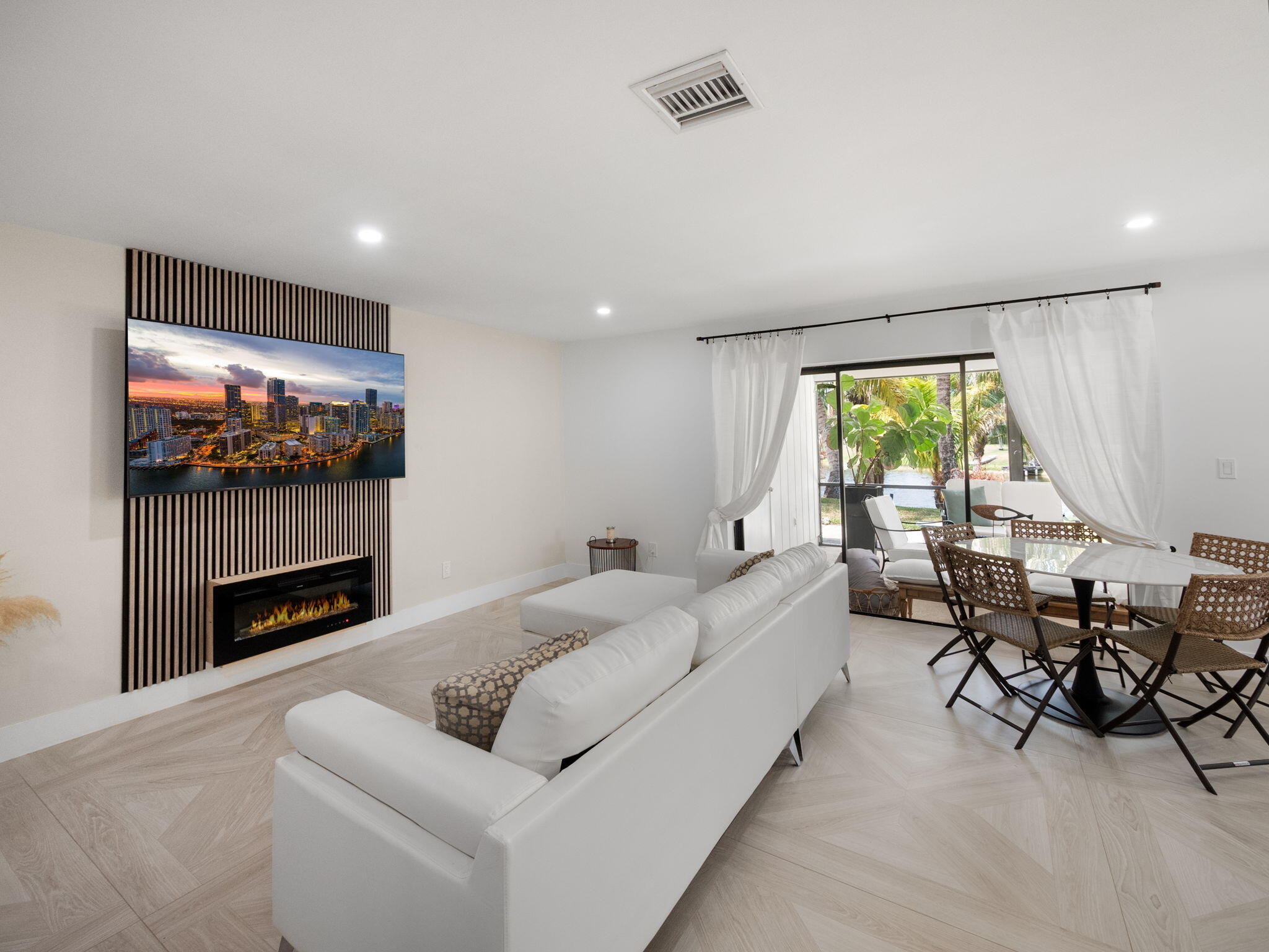 1423 Riverside Circle Wellington, FL 33414 - Photo 15 of 29 a living room with furniture a fireplace and a flat screen tv