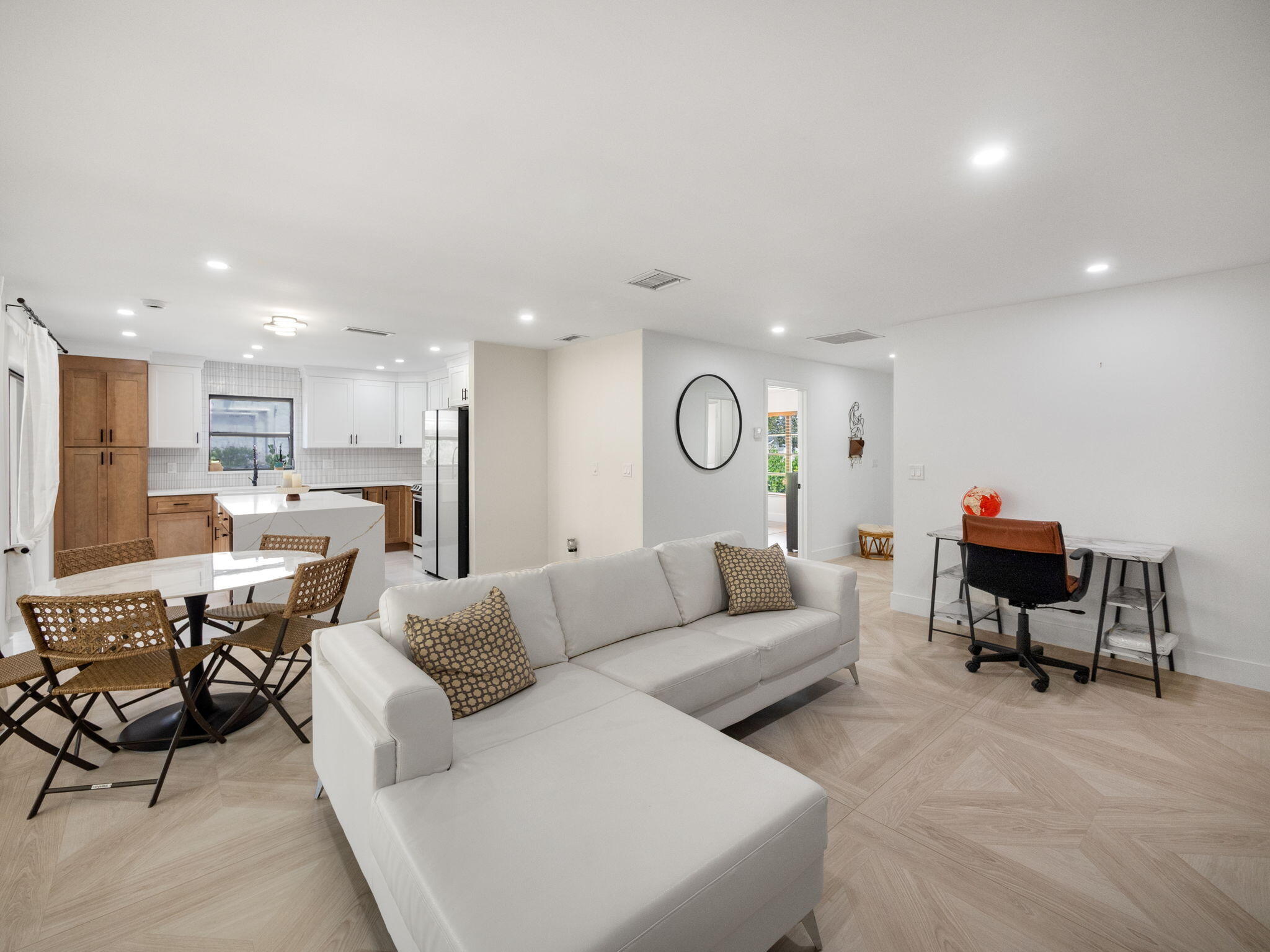 1423 Riverside Circle Wellington, FL 33414 - Photo 16 of 29 a living room with furniture kitchen view and a wooden floor