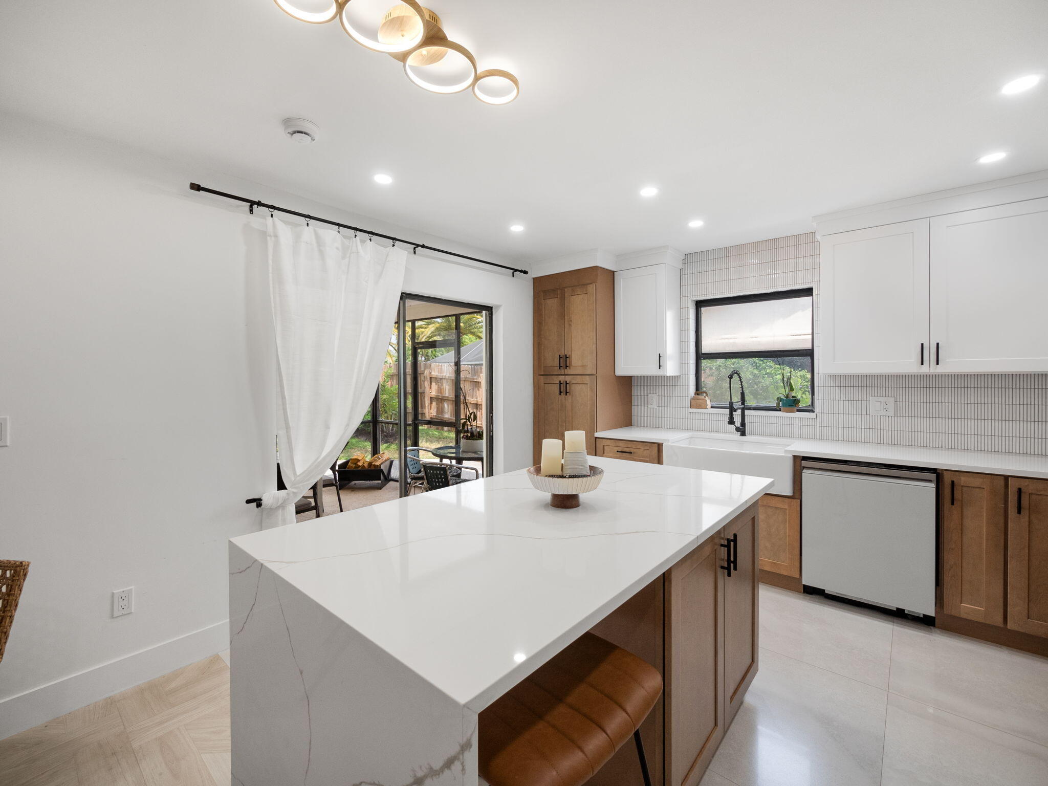 1423 Riverside Circle Wellington, FL 33414 - Photo 17 of 29 a kitchen with sink cabinets and window
