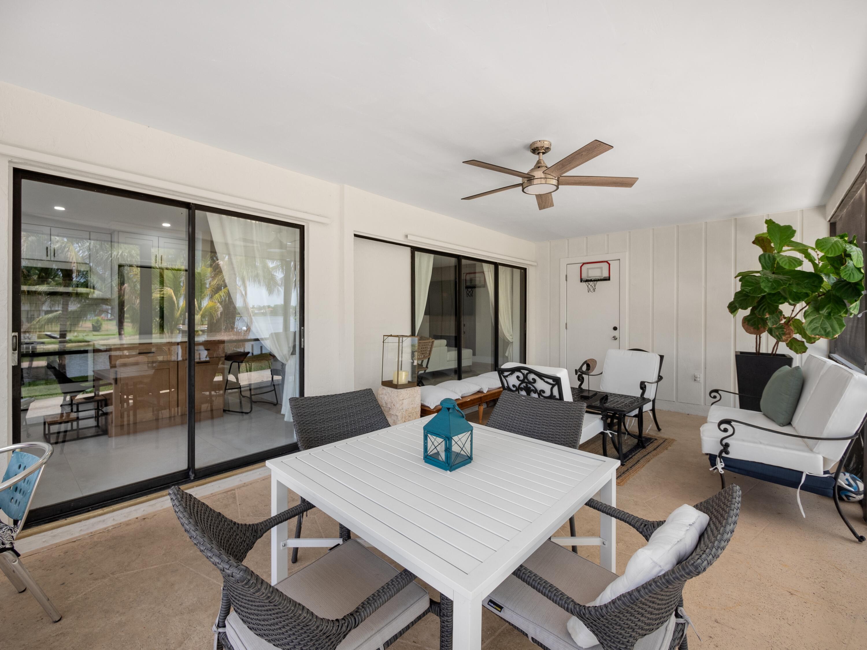 1423 Riverside Circle Wellington, FL 33414 - Photo 19 of 29 a view of a livingroom with furniture and a dining table