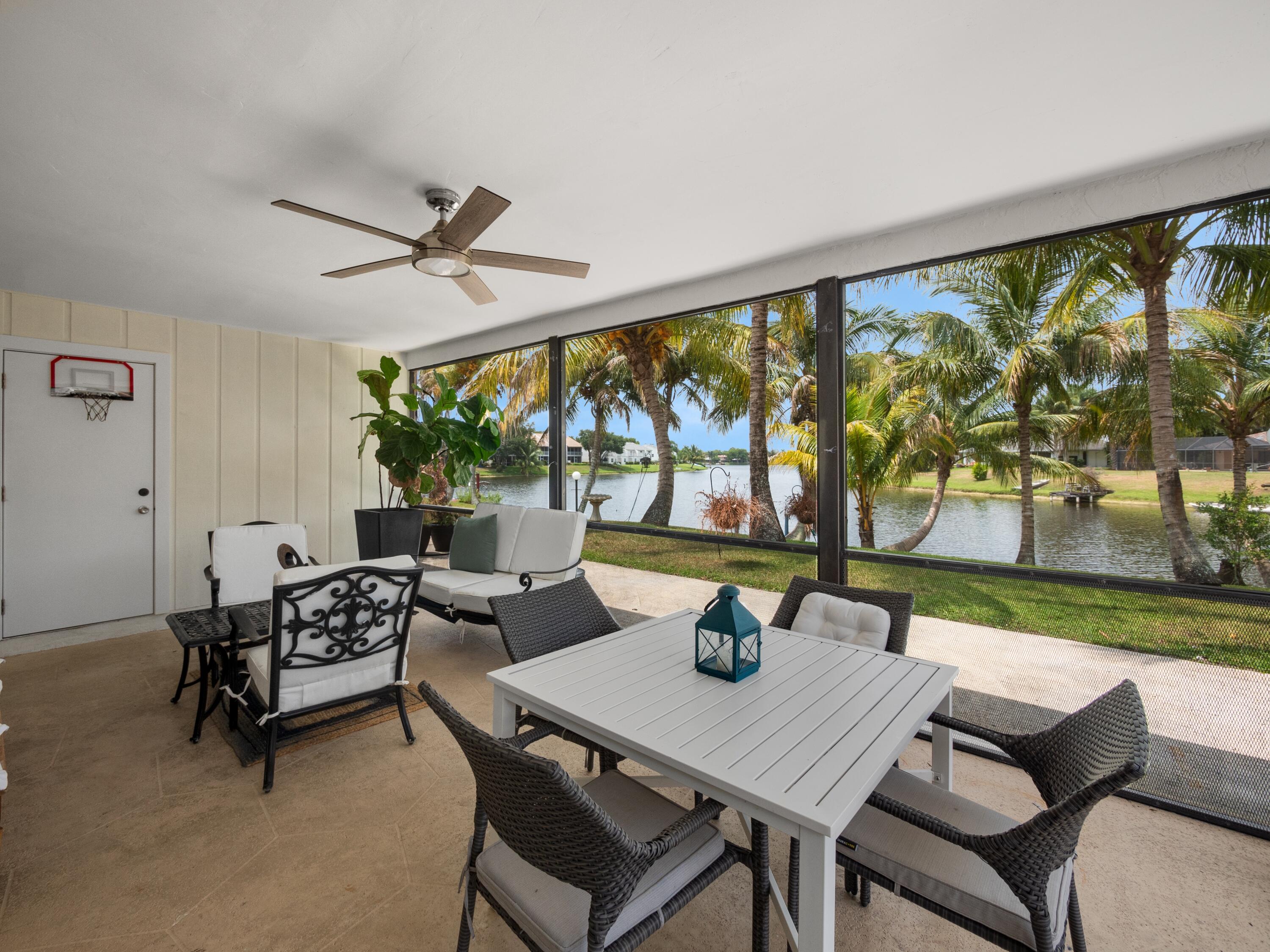 1423 Riverside Circle Wellington, FL 33414 - Photo 20 of 29 a view of a dining room with furniture window and outside view