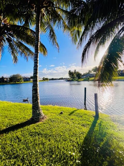 1423 Riverside Circle Wellington, FL 33414 - Photo 23 of 29 a view of a lake with a garden