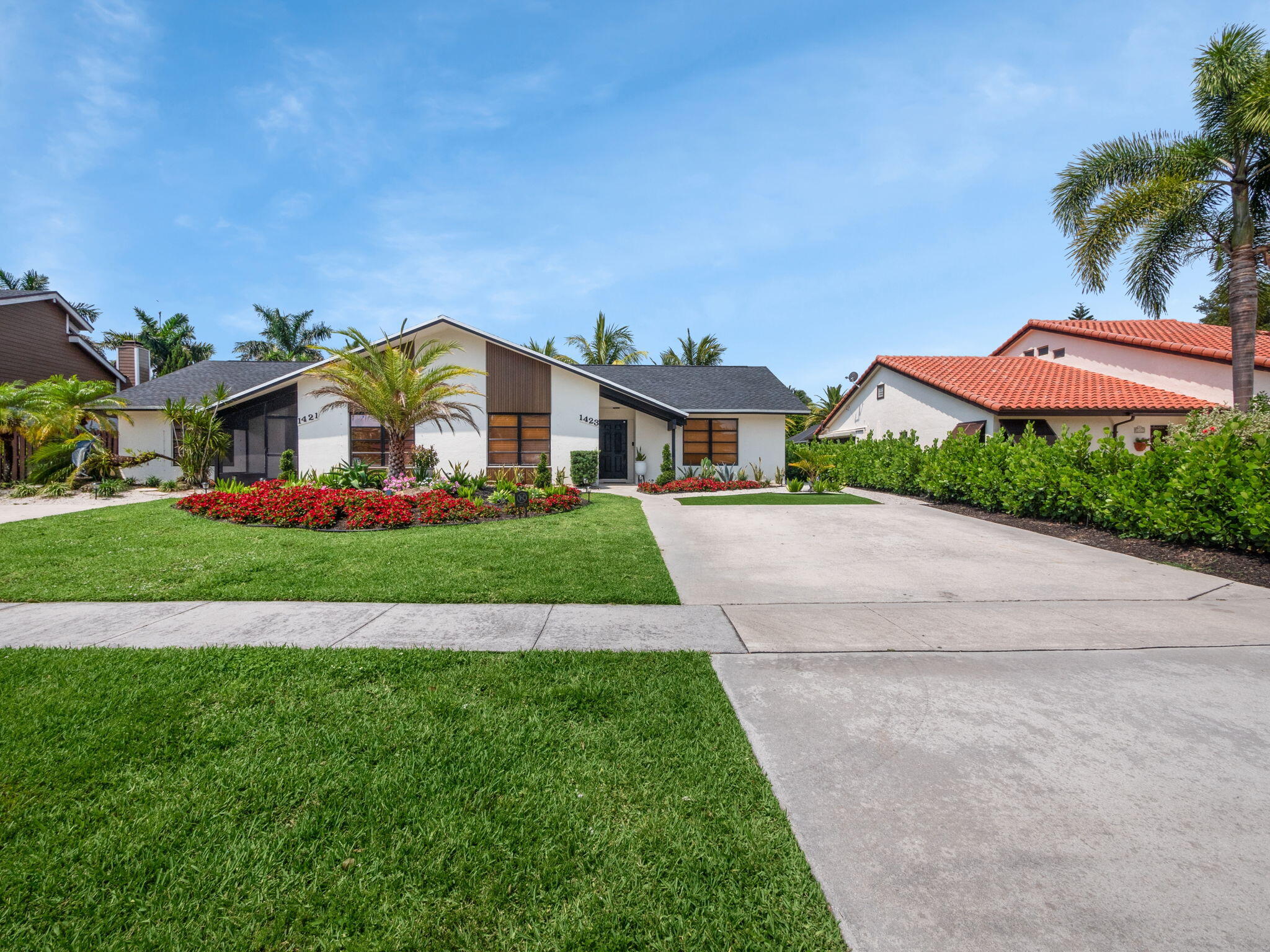 1423 Riverside Circle Wellington, FL 33414 - Photo 25 of 29 a front view of a house with a big yard