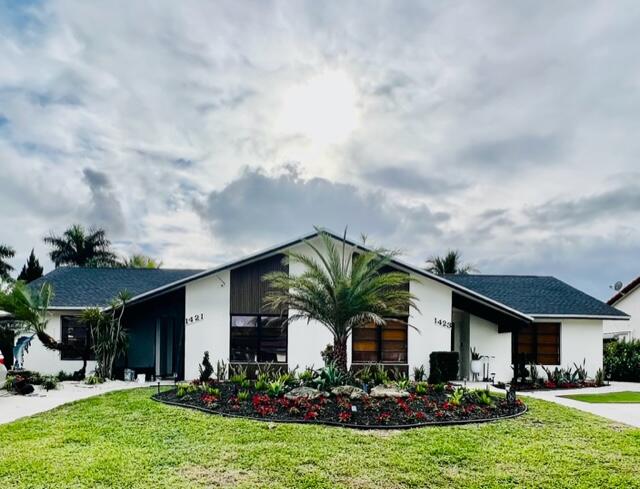 1423 Riverside Circle Wellington, FL 33414 - Photo 29 of 29 a front view of house with yard and green space