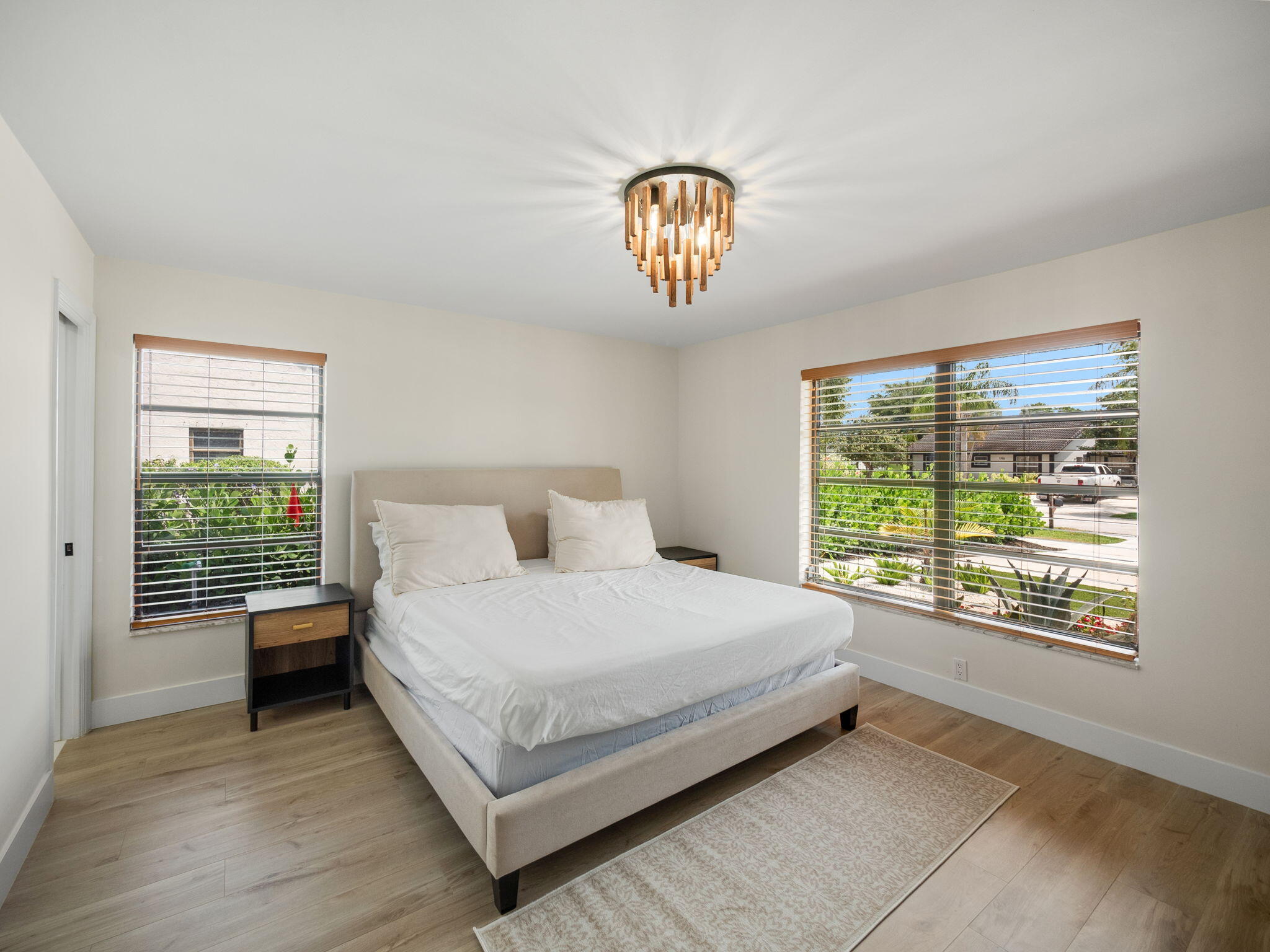 1423 Riverside Circle Wellington, FL 33414 - Photo 5 of 29 a bedroom with a bed and a large window