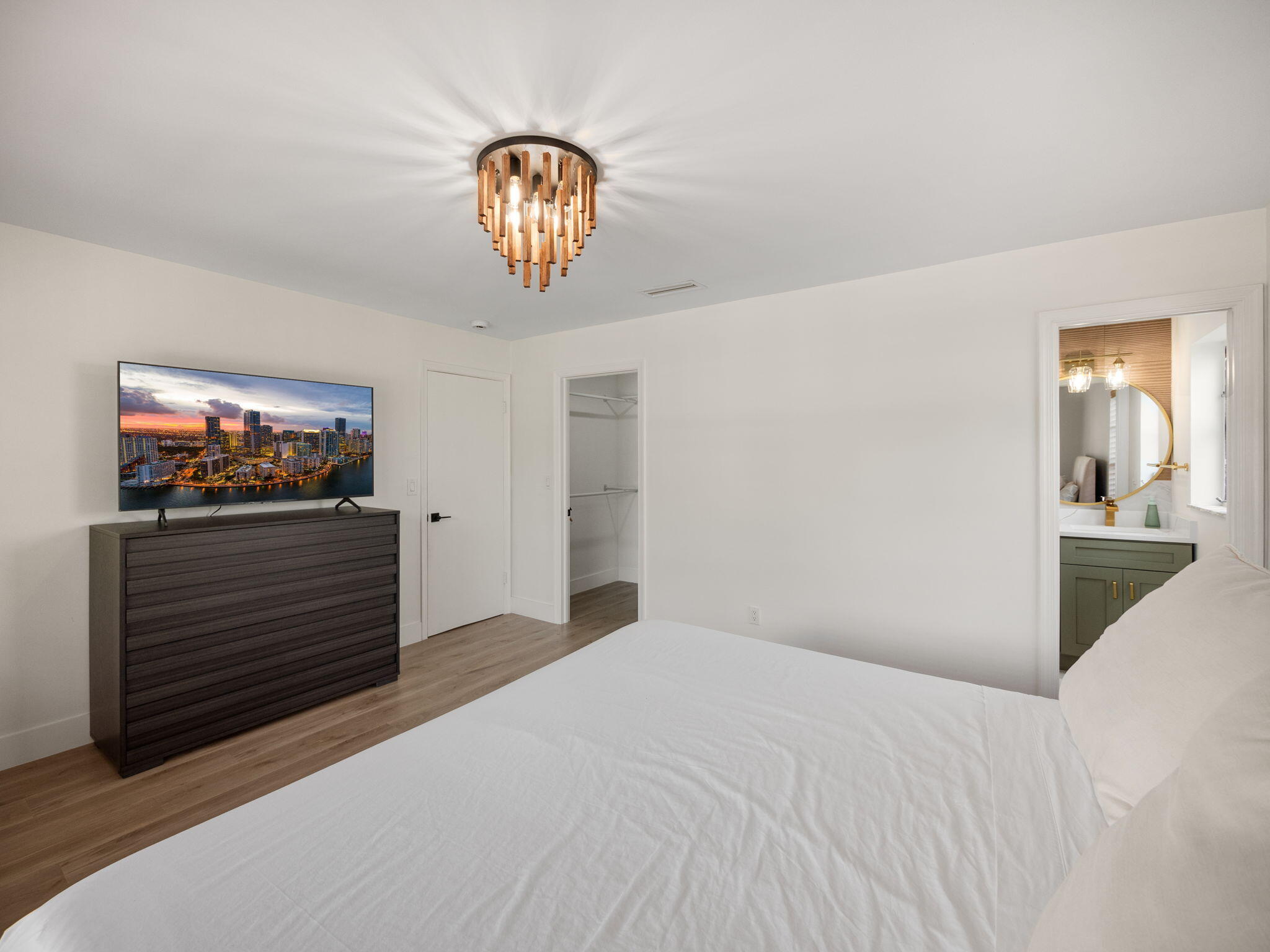 1423 Riverside Circle Wellington, FL 33414 - Photo 8 of 29 a bedroom with a bed and a flat screen tv