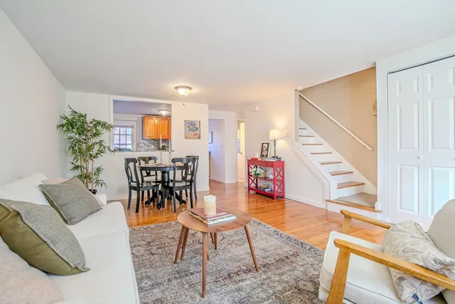 a view of a livingroom with furniture and a potted plant