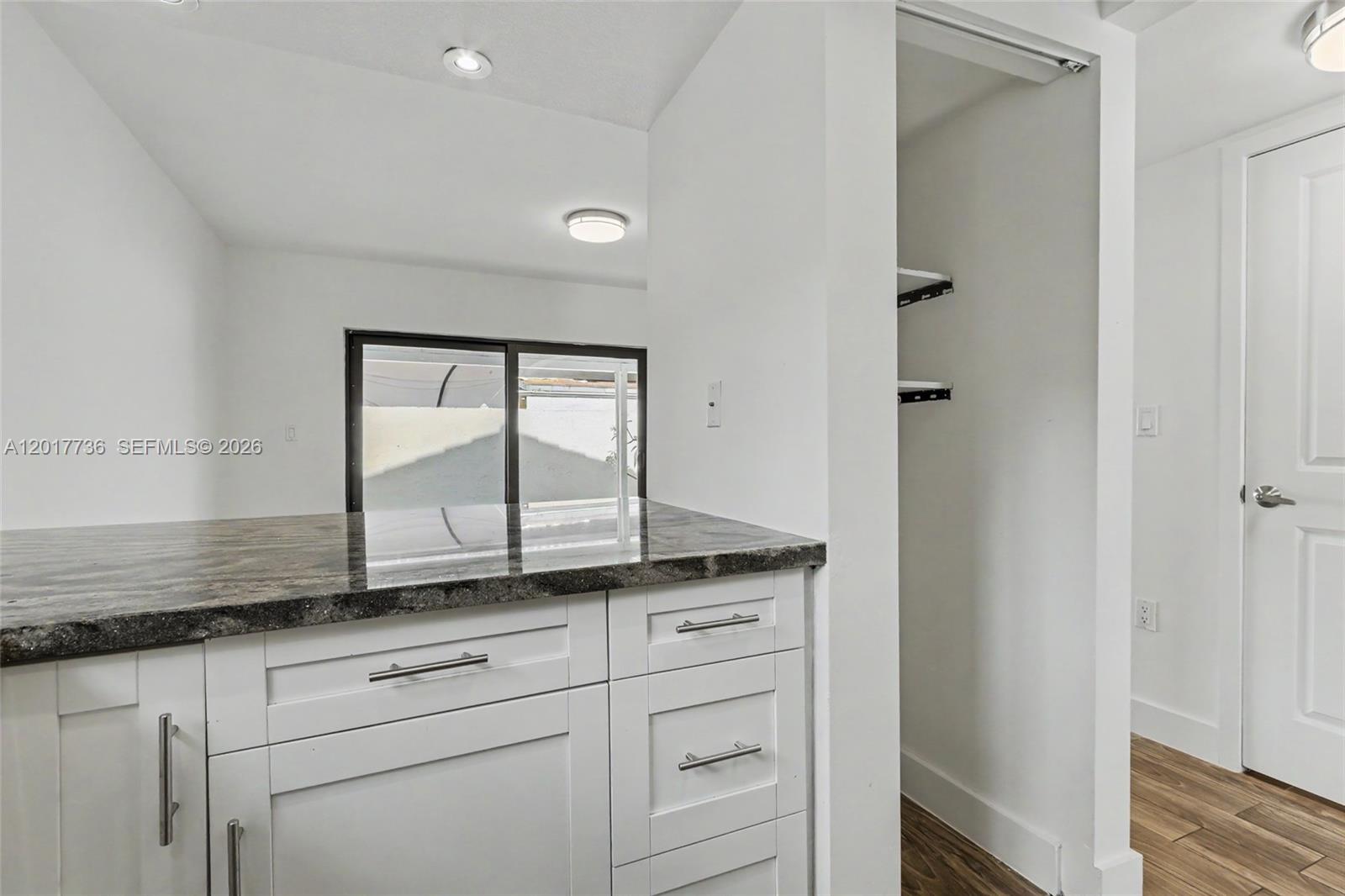 122 Southwest 56th Avenue Miami, FL 33144 - Photo 14 of 48 a sink with a mirror