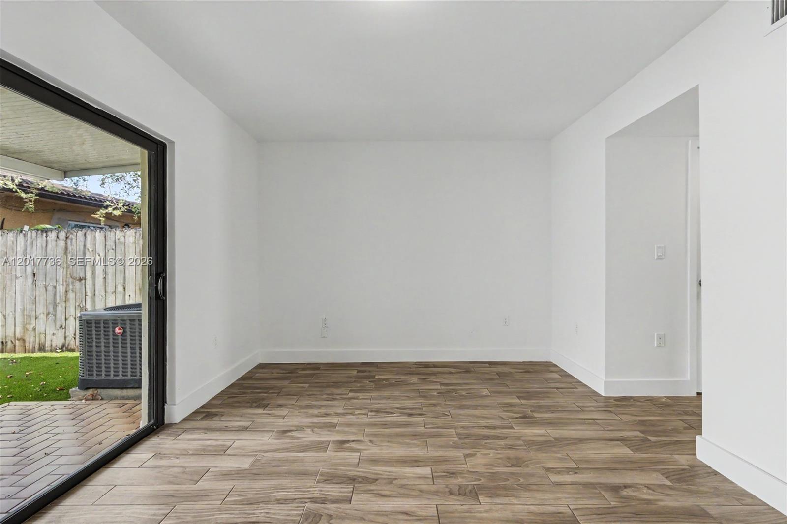 122 Southwest 56th Avenue Miami, FL 33144 - Photo 22 of 48 a view of a room with wooden floor and a window