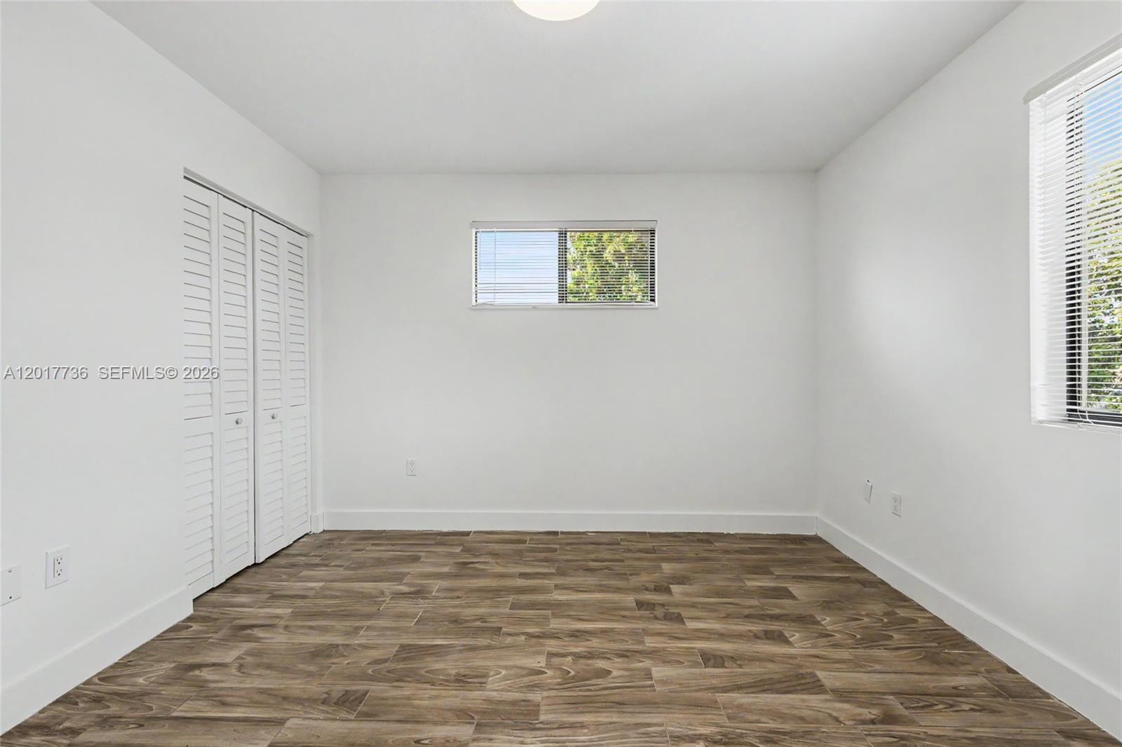 122 Southwest 56th Avenue Miami, FL 33144 - Photo 27 of 48 wooden floor in an empty room