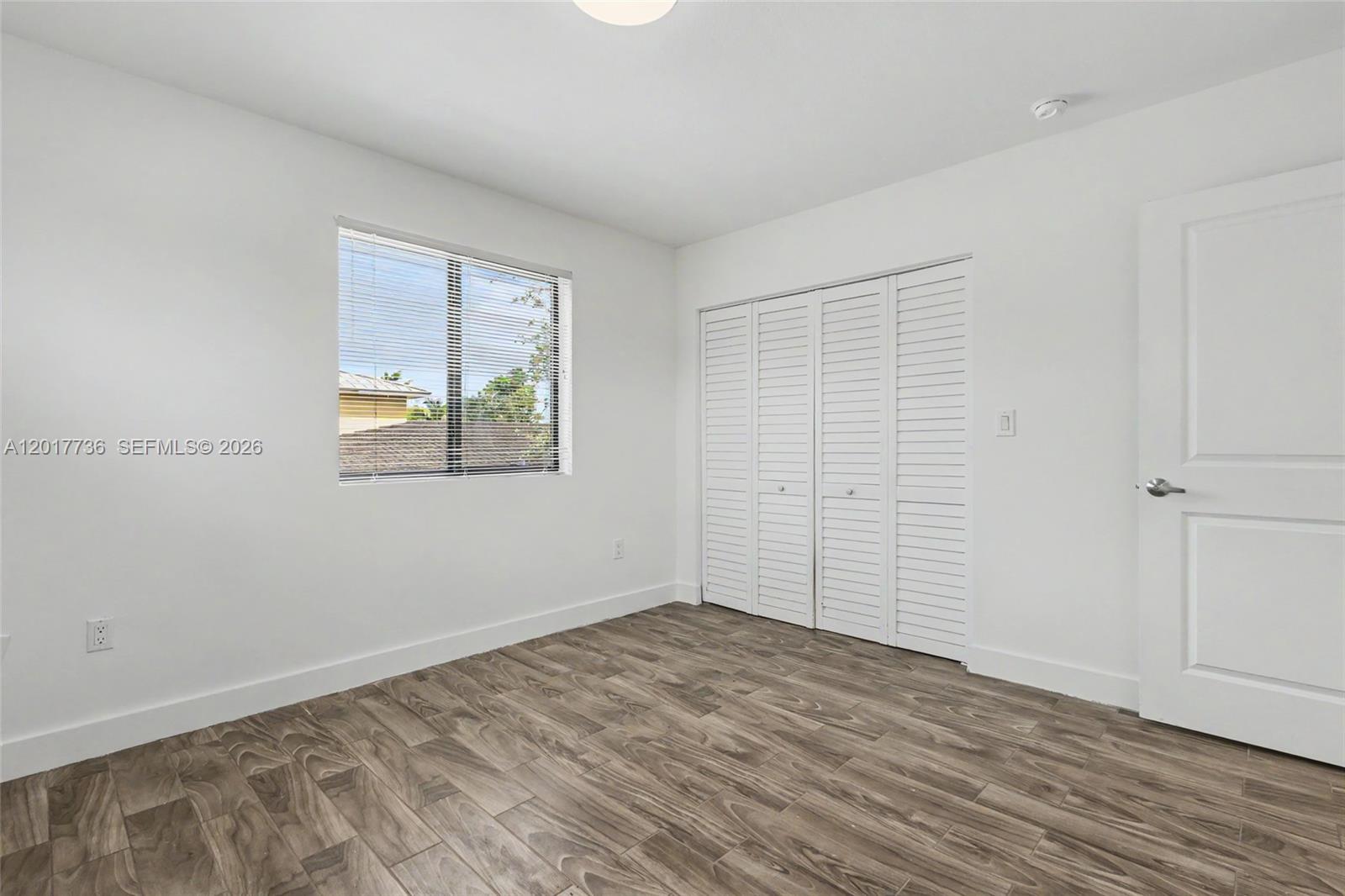 122 Southwest 56th Avenue Miami, FL 33144 - Photo 29 of 48 wooden floor in an empty room