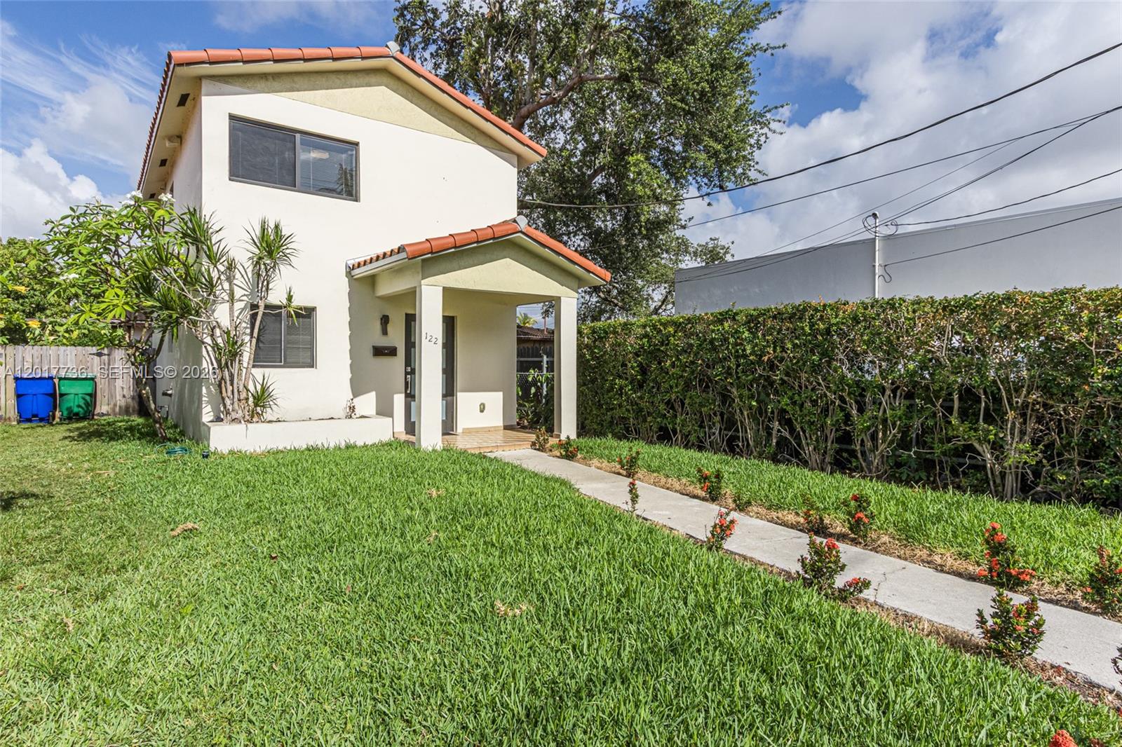 122 Southwest 56th Avenue Miami, FL 33144 - Photo 3 of 48 a view of a house with backyard and garden