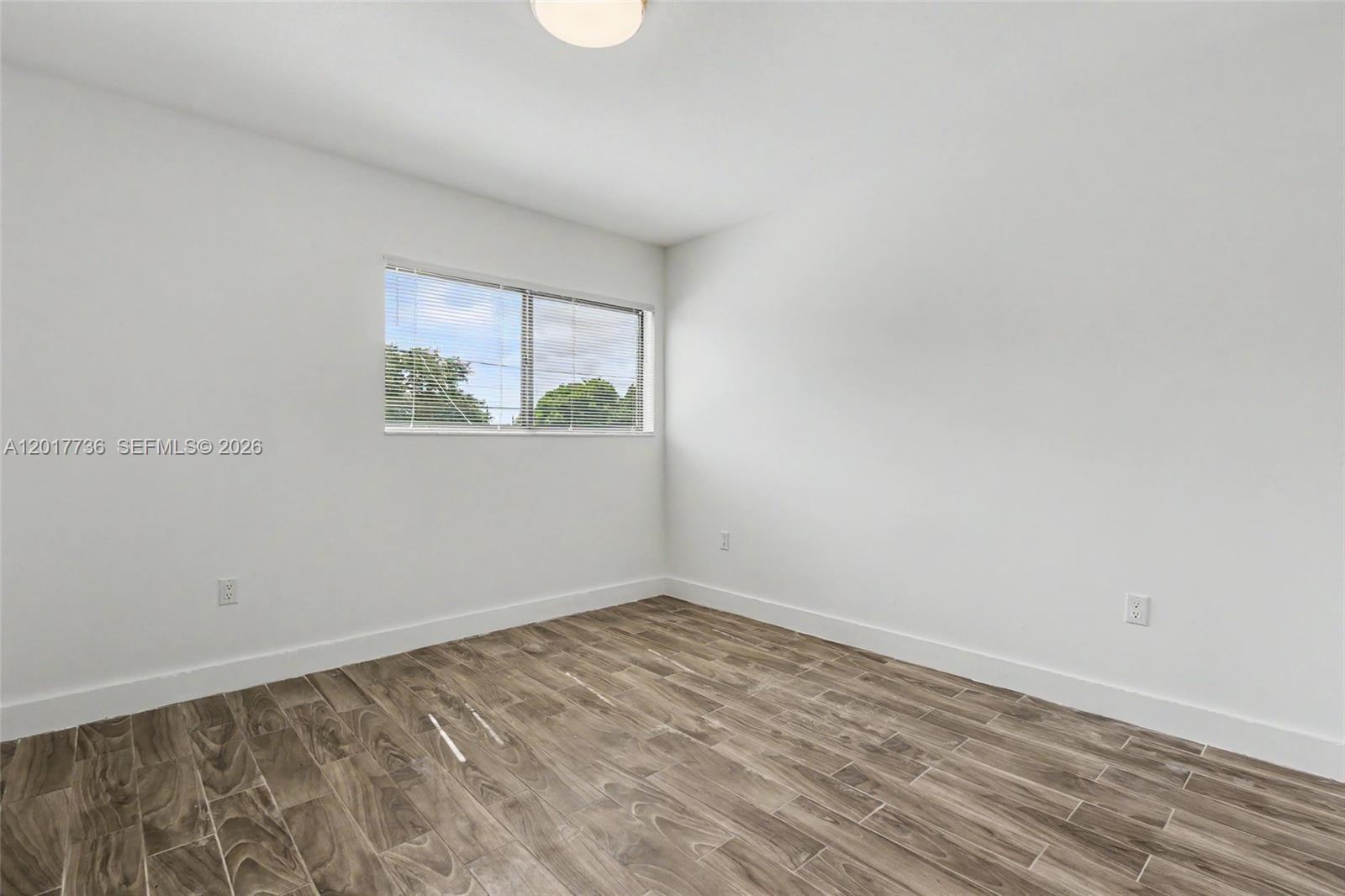 122 Southwest 56th Avenue Miami, FL 33144 - Photo 34 of 48 an empty room with a window