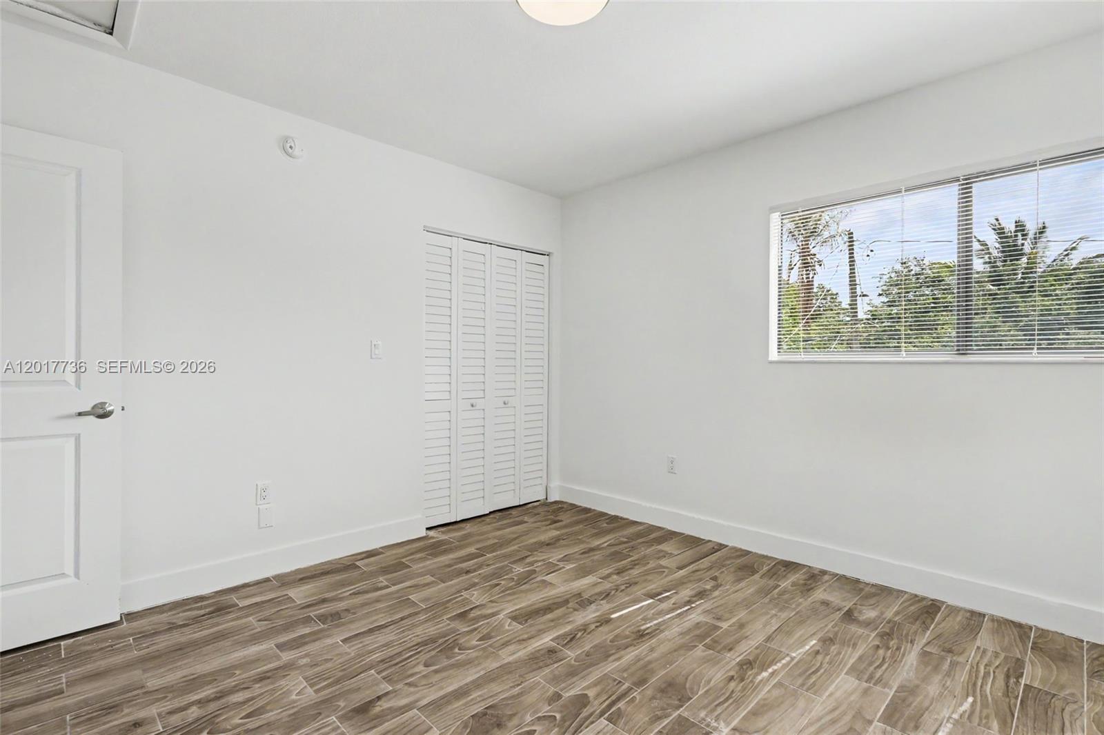 122 Southwest 56th Avenue Miami, FL 33144 - Photo 36 of 48 wooden floor in an empty room