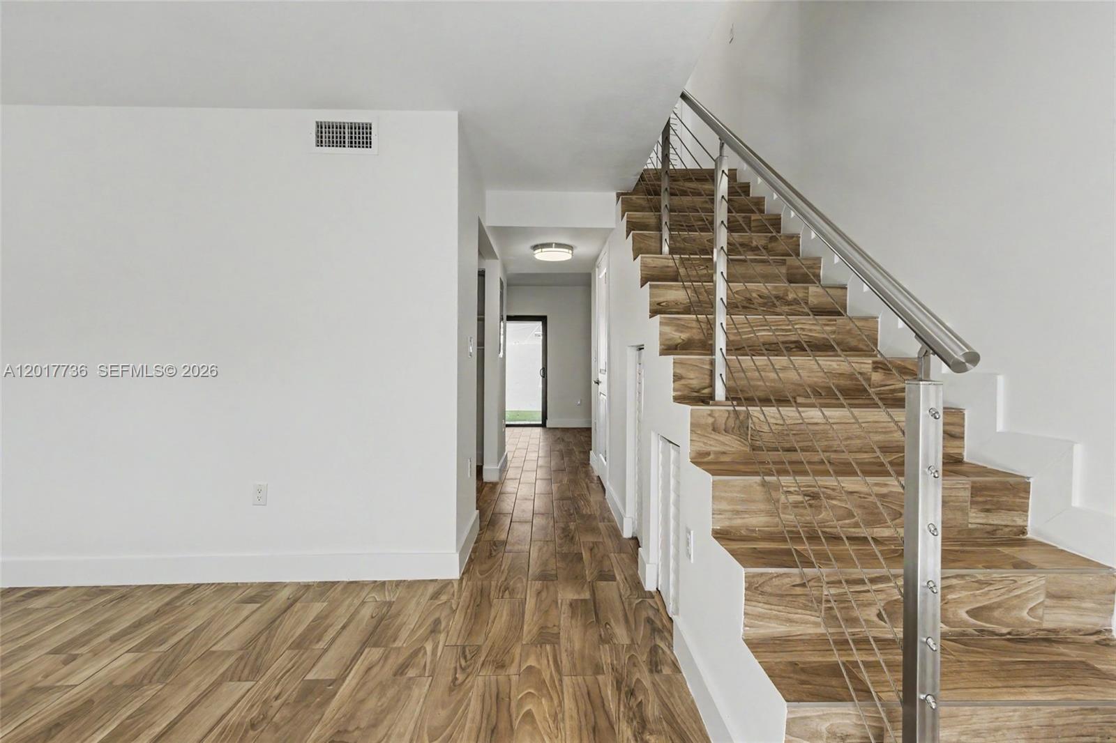 122 Southwest 56th Avenue Miami, FL 33144 - Photo 5 of 48 a view of a hallway with wooden floor and entryway