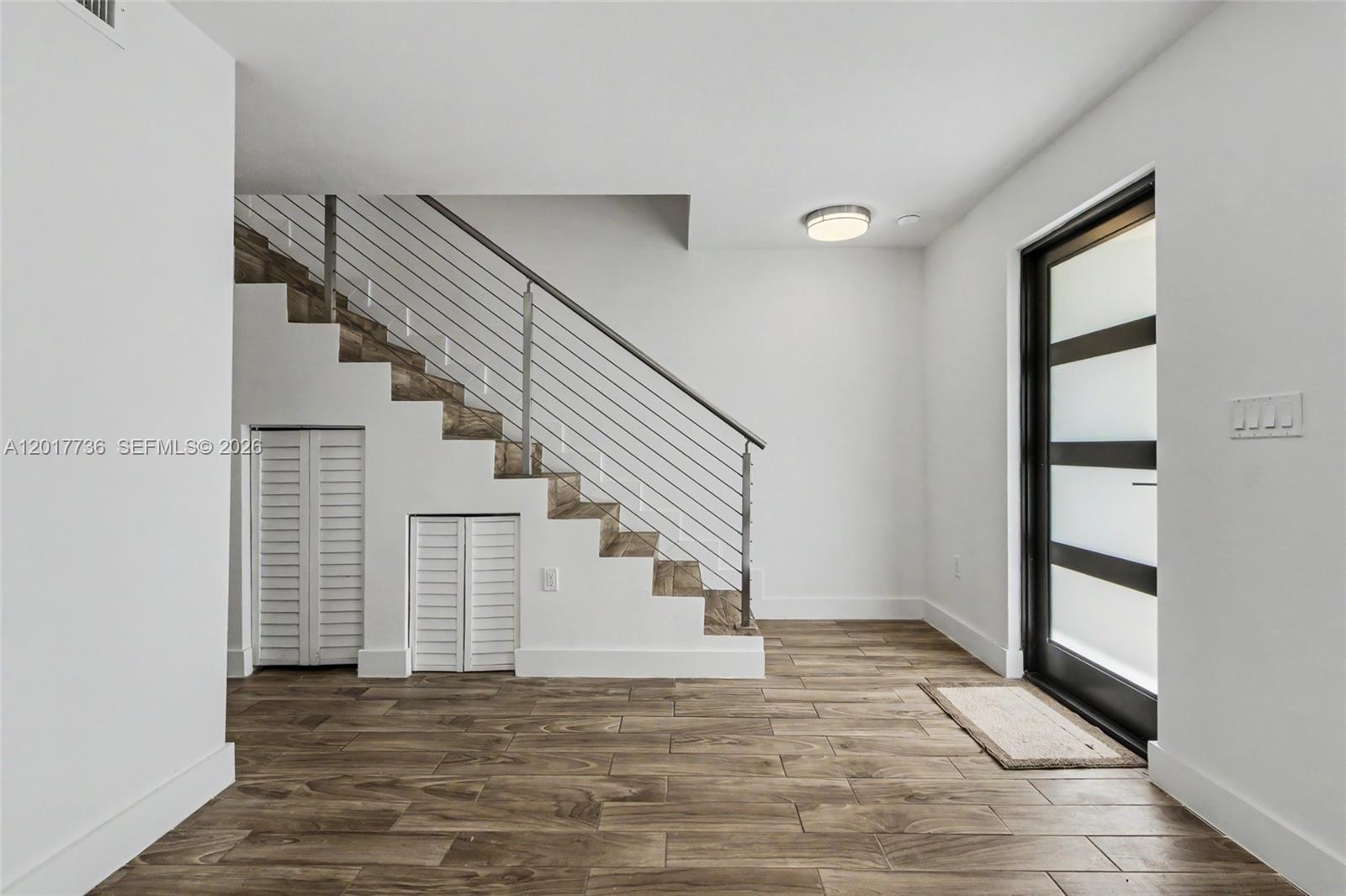 122 Southwest 56th Avenue Miami, FL 33144 - Photo 8 of 48 a view of entryway and hall with wooden floor