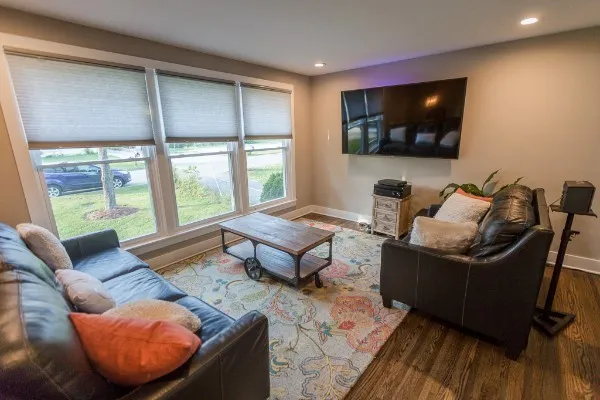 a living room with furniture and a flat screen tv