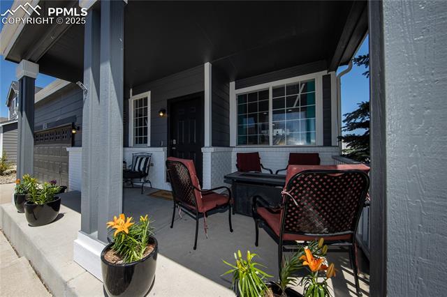 7511 Coffee Road Peyton, CO 80831 - Photo 4 of 38 View of patio / terrace featuring a porch