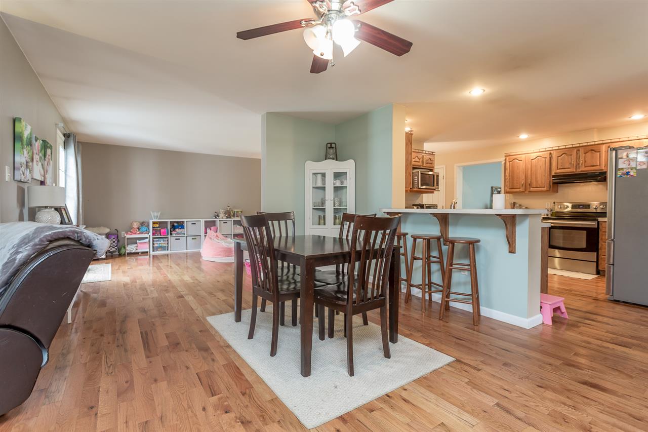 10882 Cook Town Road Bridgewater, VA 22812 - Photo 11 of 47 a view of a dining room with furniture and wooden floor