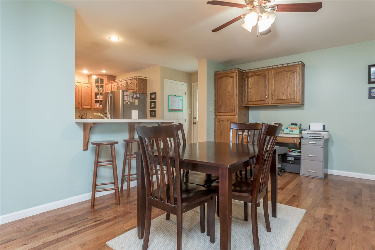 10882 Cook Town Road Bridgewater, VA 22812 - Photo 12 of 47 a view of a dining room with furniture wooden floor and chandelier