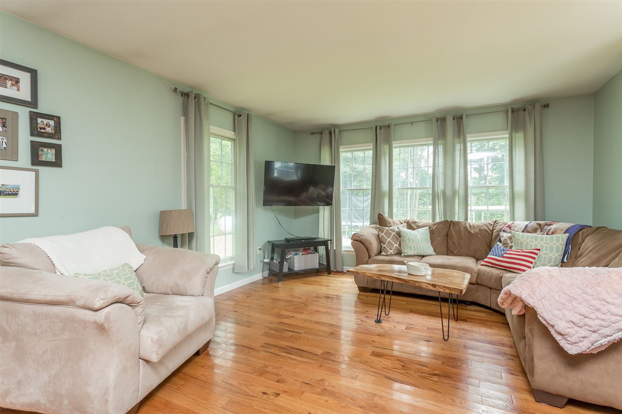 10882 Cook Town Road Bridgewater, VA 22812 - Photo 15 of 47 a living room with furniture wooden floor and a large window