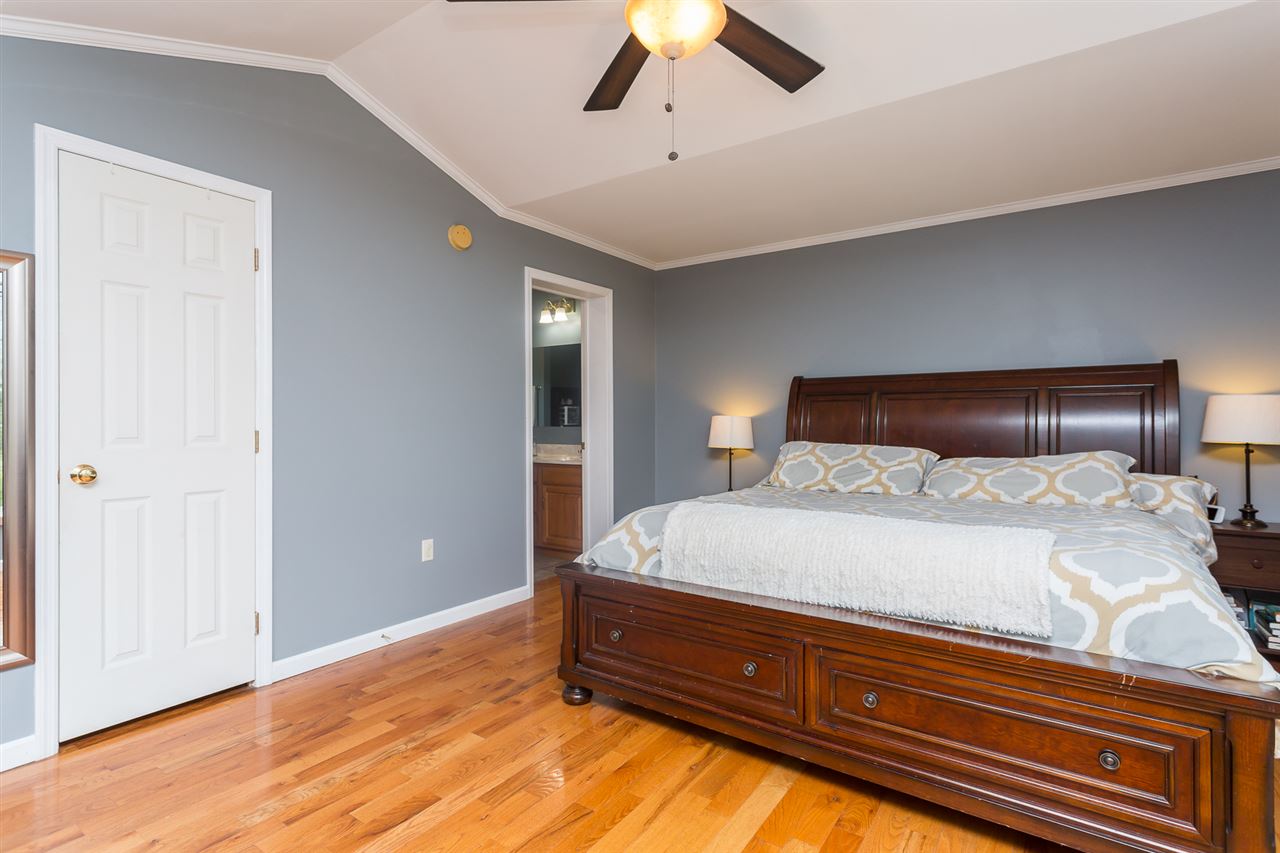 10882 Cook Town Road Bridgewater, VA 22812 - Photo 19 of 47 a bedroom with a bed and painting on the wall