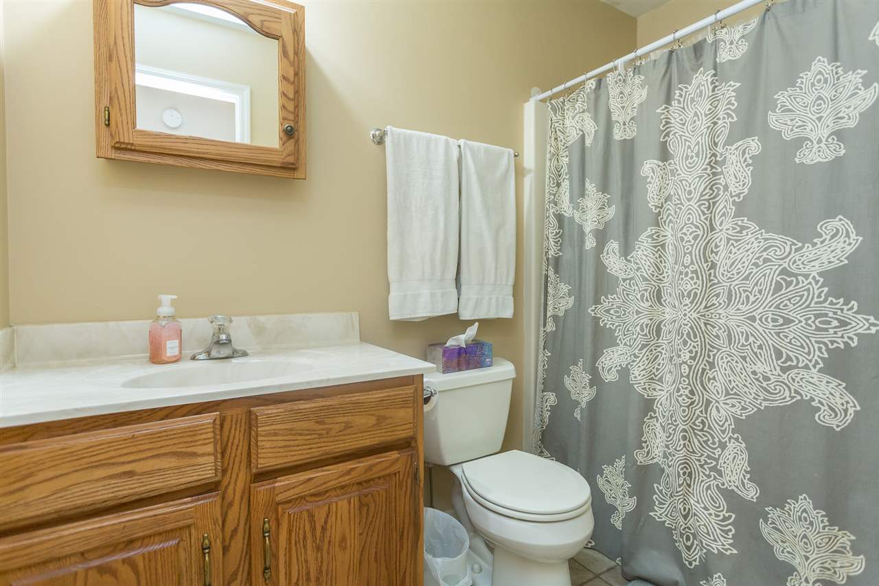 10882 Cook Town Road Bridgewater, VA 22812 - Photo 23 of 47 a bathroom with a granite countertop sink mirror vanity and toilet