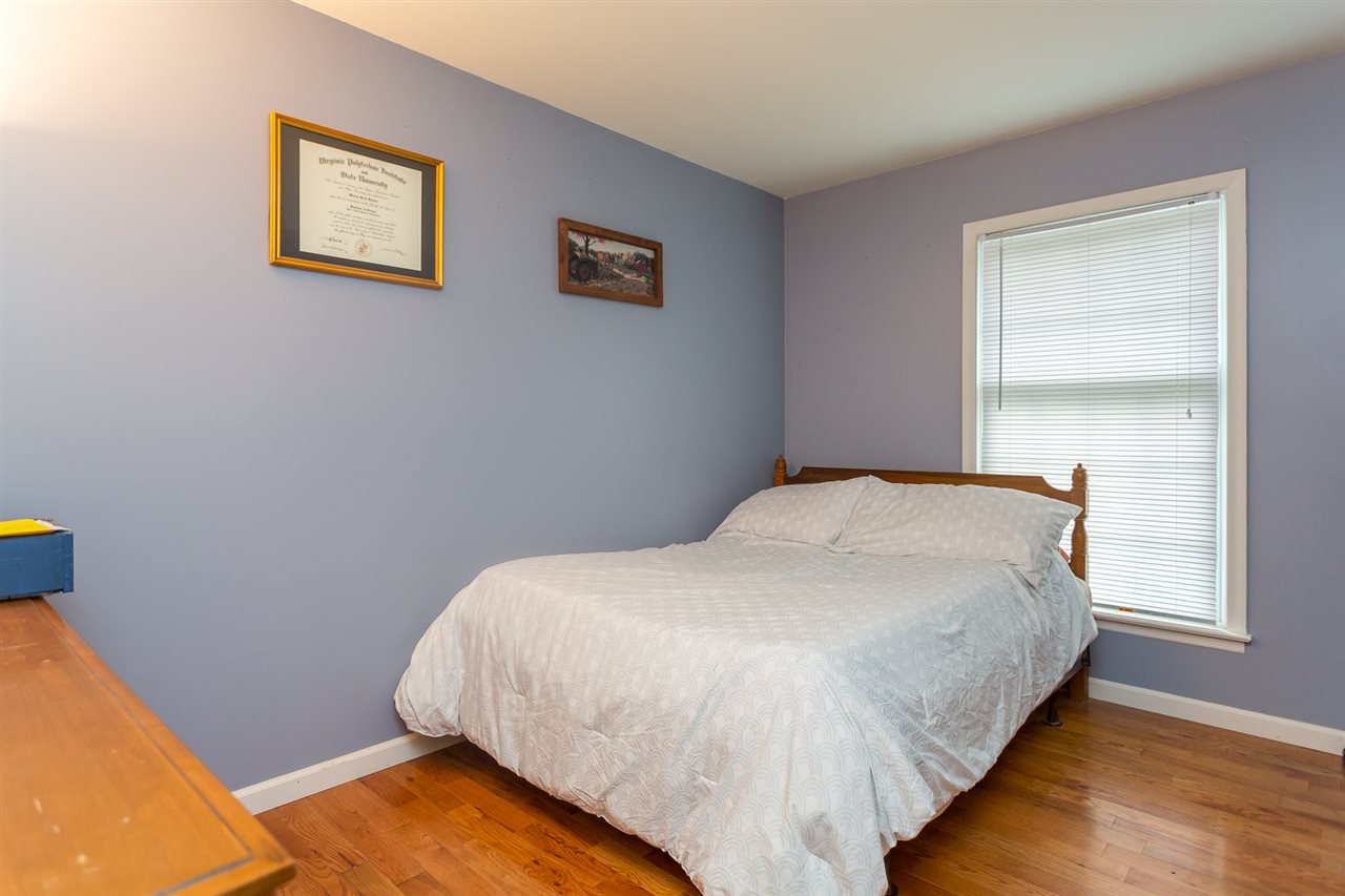 10882 Cook Town Road Bridgewater, VA 22812 - Photo 24 of 47 a bed sitting in a bedroom next to a window