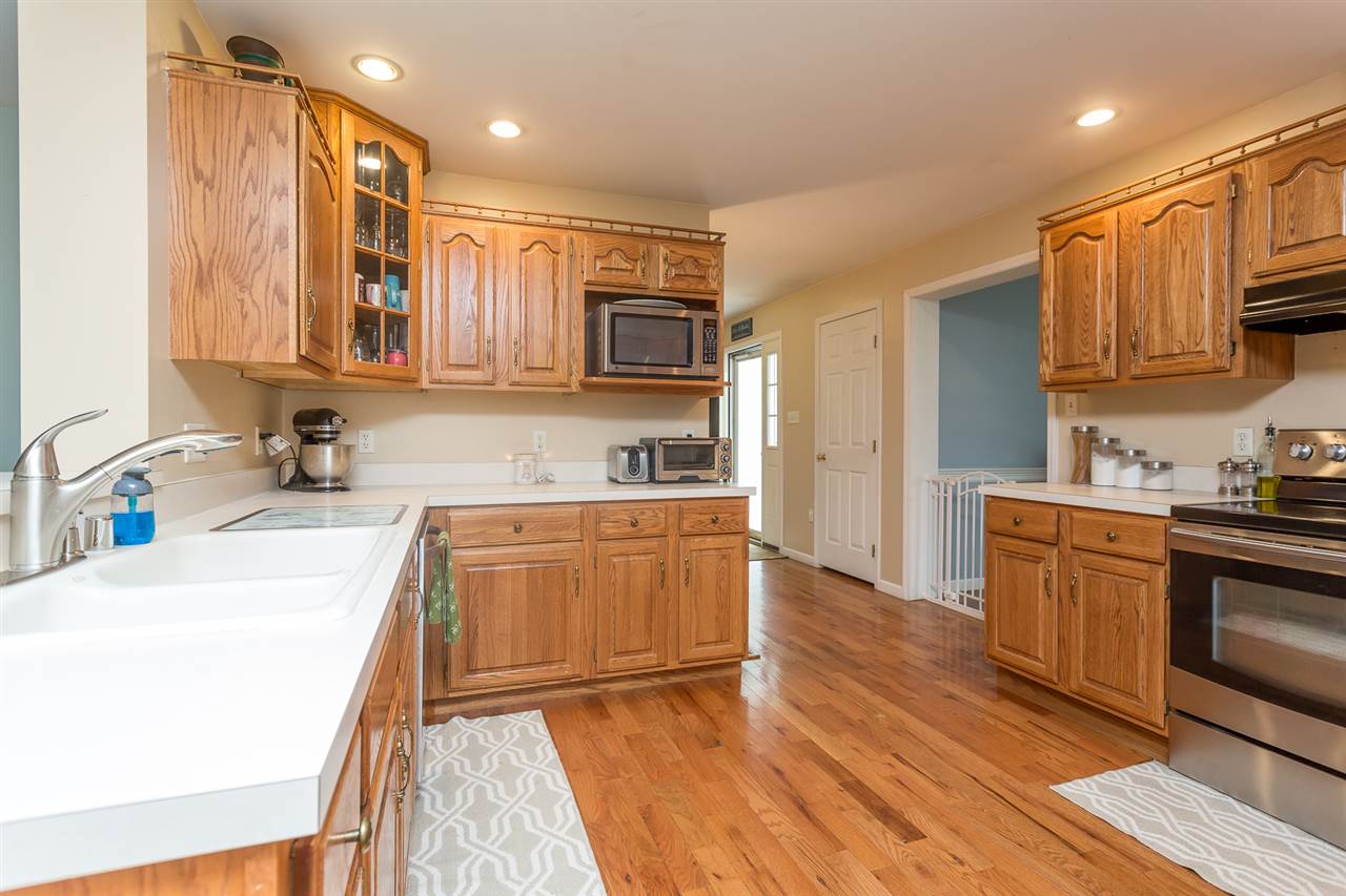 10882 Cook Town Road Bridgewater, VA 22812 - Photo 7 of 47 a kitchen with stainless steel appliances granite countertop a sink stove and refrigerator
