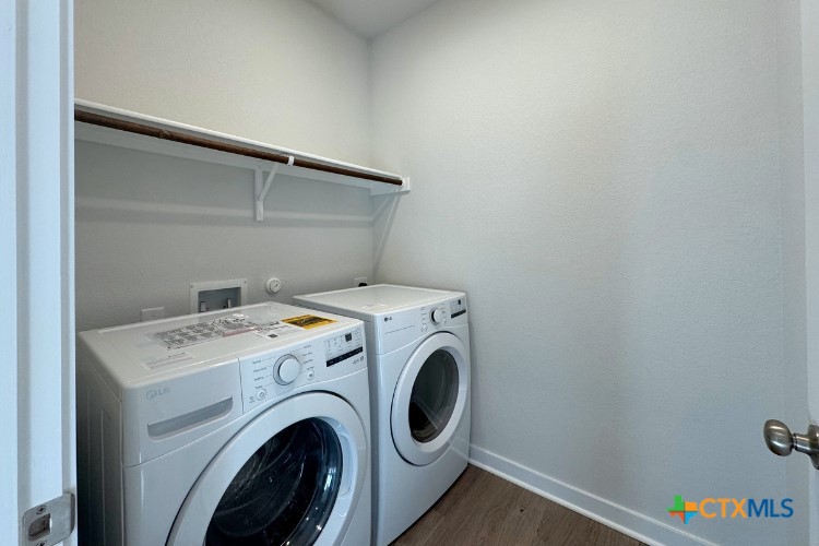 220 Escape Way Jarrell, TX 76537 - Photo 6 of 14 a utility room with dryer and washer