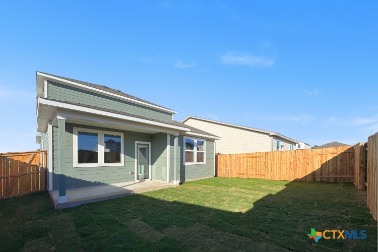 220 Escape Way Jarrell, TX 76537 - Photo 7 of 14 a house view with a garden space