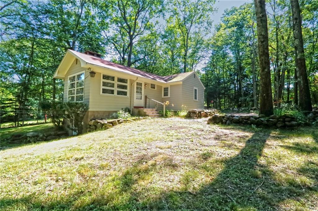 211 Carrington Road Bethany, CT 06524 - Photo 1 of 1 a front view of a house with a yard and garage