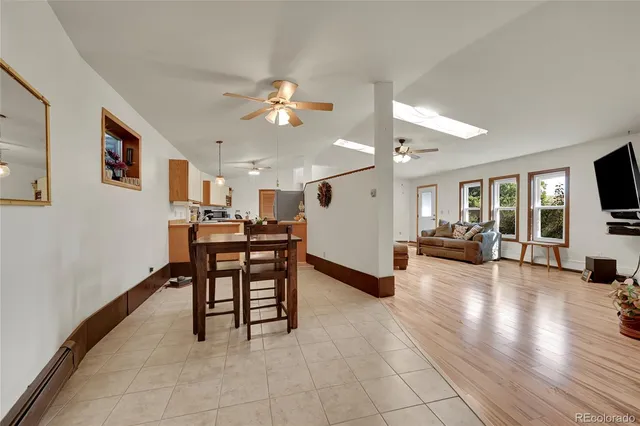 a view of a livingroom with furniture and a flat screen tv