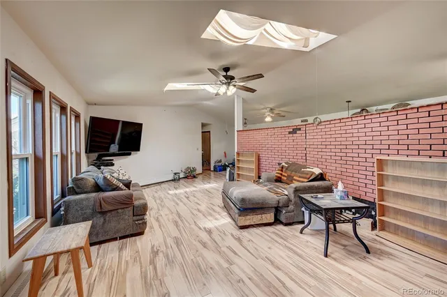 a bedroom with furniture and a chandelier