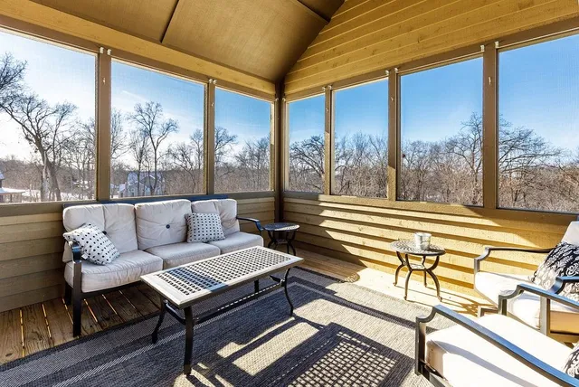 a view of a house with a bed and chair