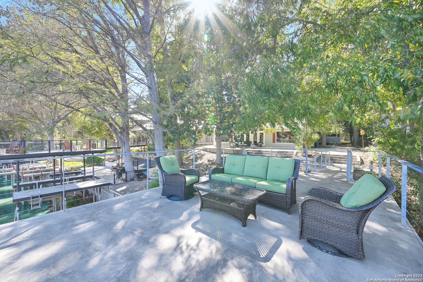 a view of a patio with couches chairs and a fire pit