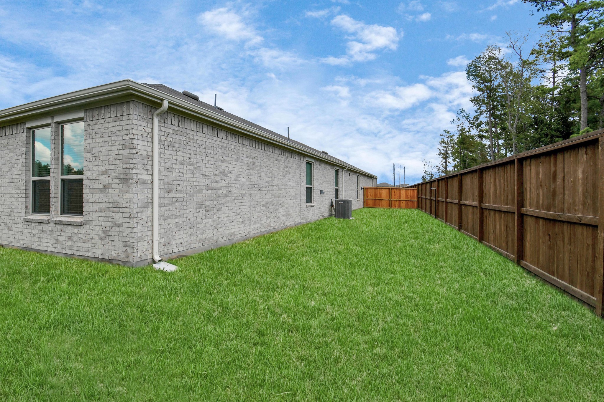 16150 Elbridge Court Conroe, TX 77302 - Photo 28 of 46 Plenty of room in the backyard for outdoor playing.