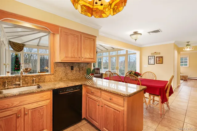 a kitchen with stainless steel appliances granite countertop a sink and cabinets