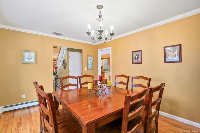 a dining room with furniture and window