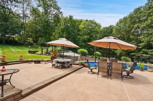 an outdoor space with patio and outdoor seating