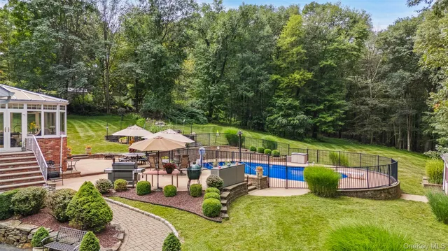 an outdoor space with furniture and garden