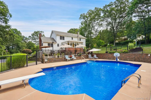 a view of a swimming pool with a patio