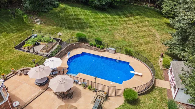 a view of swimming pool with seating area