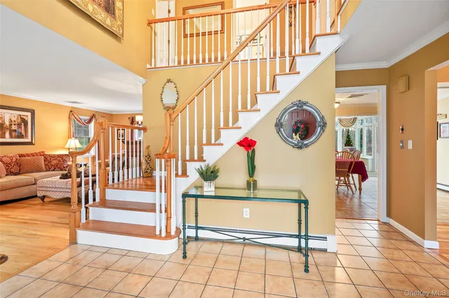 a view of entryway kitchen and hall way with furniture