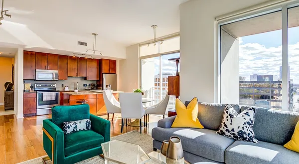a living room with furniture and a large window