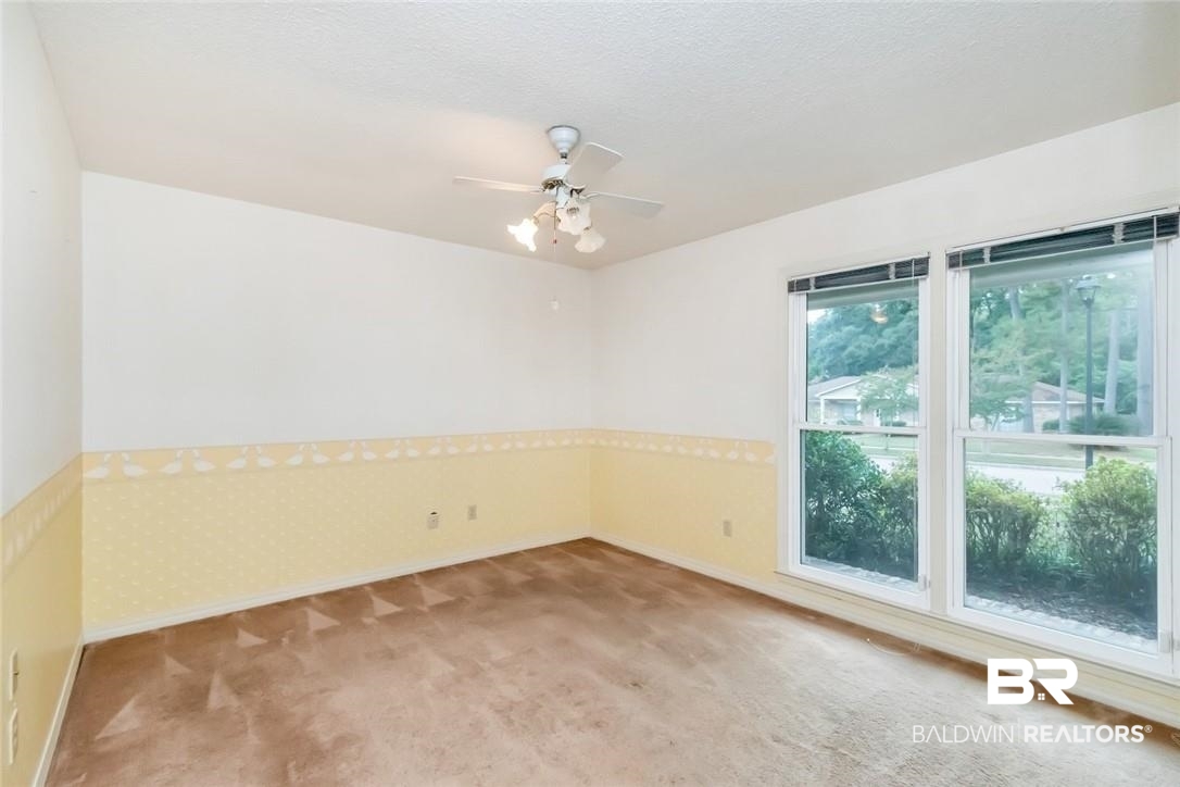 6109 Timberly Road North Mobile, AL 36609 - Photo 20 of 26 Spare room with ceiling fan and carpet