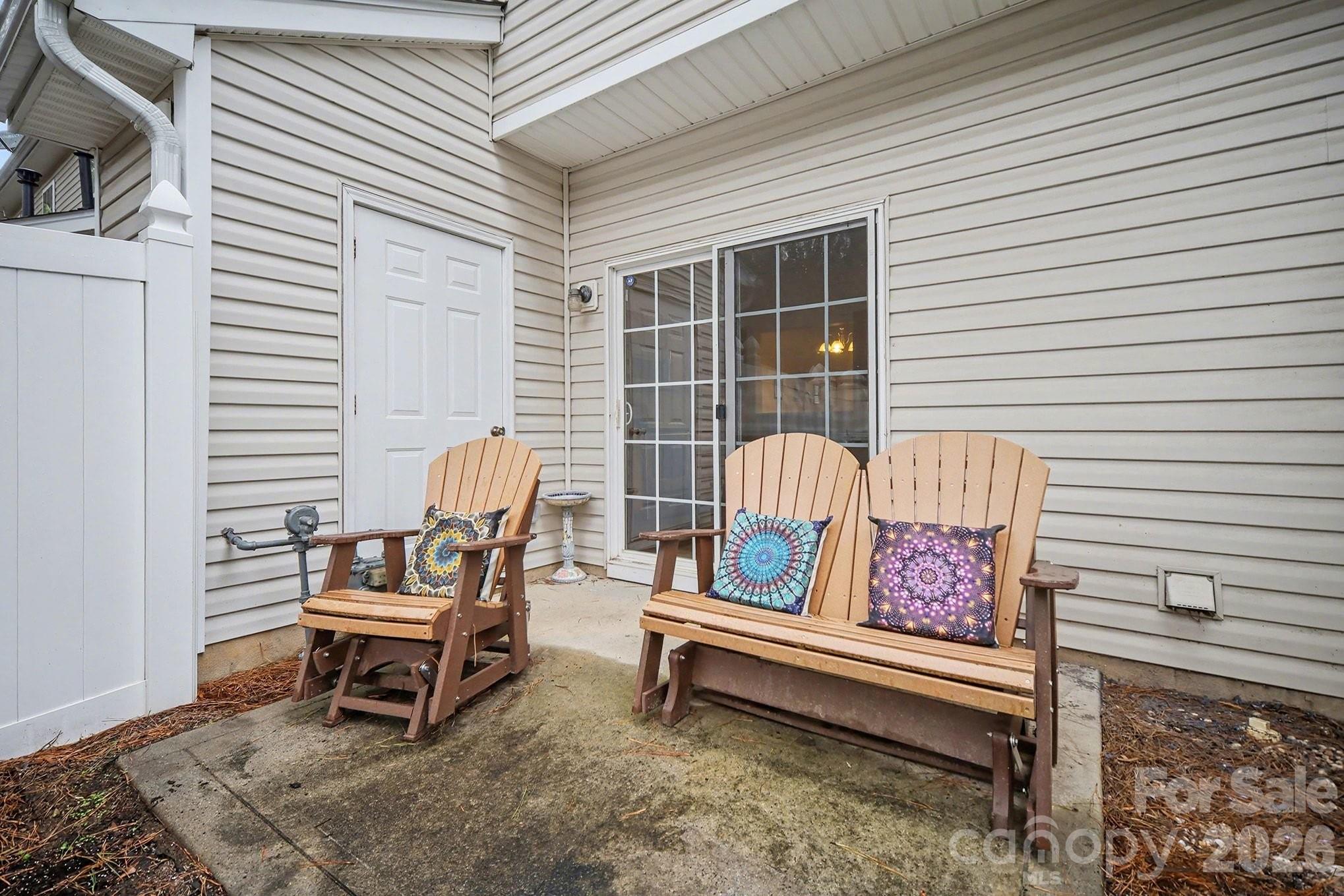 8048 Stoneham Court Matthews, NC 28105 - Photo 14 of 15 a roof deck with a couch and chairs